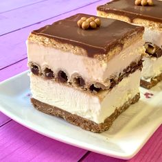 two pieces of cake sitting on top of a white plate