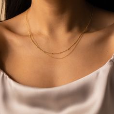 B E A D E D ∙ D U O ∙ C H A I N ∙ N E C K L A C E Get two in one with our minimalist Beaded Duo Chain necklace. With one satellite chain and one dainty chain layered together, this choker necklace gives the illusion that you put in the extra effort when you really spent the extra time in bed. * Material: High Quality Solid 925 Sterling Silver * Finish: Sterling Silver ∙ 18K Gold * Featuring a Minimalist Chain layered with a Dainty Beaded Chain, adjustable length 16 inches to 18 inches. H O W ∙ T Minimalist Double Strand Clavicle Chain Layered Necklace, Minimalist Beaded Chain Layered Necklace, Minimalist Everyday Beaded Chain Layered Necklace, Minimalist Double Strand Delicate Chain Necklace, Minimalist Double Strand Layered Necklace, Minimalist Double Chain Necklace, Minimalist Double Strand Layered Necklace With Adjustable Chain, Minimalist Beaded Chain Layered Necklace As Gift, Minimalist Satellite Chain Necklace For Layering