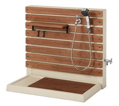 a wooden shower head and hand held shower faucet