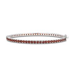 Richly hued round garnets adorn this sophisticated bangle fashioned in classic sterling silver. The bracelet measures 7.25 inches and secures with a box clasp. Classic Gemstone Bangle For Anniversary, Elegant Stackable Garnet Jewelry, Classic Red Gemstone Bracelets, Classic Formal Bangle With Gemstone, Classic Red Gemstone Bracelet, Classic Sterling Silver Bracelet With Gemstone, Classic Round Sterling Silver Bracelet With Gemstone, Classic Sterling Silver Gemstone Bracelet, Formal Garnet Gemstone Bracelets