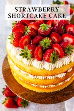 there is a cake with strawberries on top and the words strawberry shortcake cake above it