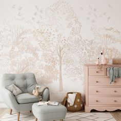 a chair and ottoman in front of a tree wallpaper