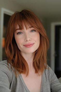 Woman with a shoulder length bob haircut and bangs. Shoulder Length Hair Side Fringe, Fringe And Shoulder Length Hair, Medium Length Haircut For Fine Hair Oval Face, Fine Hair Color Ideas Shoulder Length, Shoulder Length With Fringe, Shoulder Length Hair Bangs Layers, Long Bob And Bangs, Straight Red Hair With Bangs