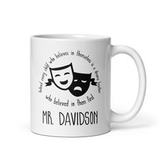 a white coffee mug with the words mr davidson written on it and a black mask