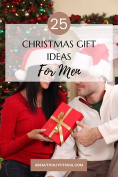 a man and woman sitting next to each other in front of a christmas tree with presents