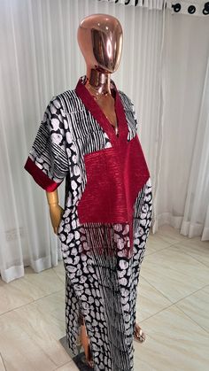 This Adire Ankara Silk Kaftan maxi dress is made with Polysilk. It can be styled in different ways, you can dress it up with high heels or dress down with flats/sneakers. The Hand can be worn in 2 ways. one ways shows off the arm, the 2nd way has the arm covered for modesty. Notice the slits.Other prints are also available, kindly start a conversation to ask for more information and pics.Contact us for custom looks and more style options. Sizing 🌺 Your height or desired kaftan length is needed. Adire Kaftan Styles, Ankara Kaftan Styles, Kampala Kaftan Styles For Women, Red Kaftan, Boubou Styles For Women, Kaftan Styles, Bubu Gown Styles, The Slits, Short African Dresses