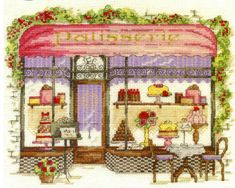 a cross stitched picture of a store front with flowers on the window sill