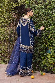 Blue Sharara Salwar Kameez Pakistani Wedding Dresses in a hand-crafted raw silk blue shirt with round neck & sleeves paired with Sharara. Fast Shipping. Pants And Shirt