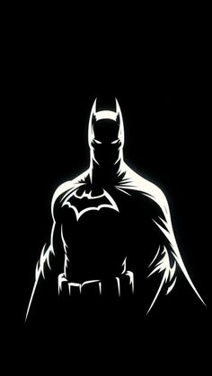 the dark knight batman silhouette on a black background with light coming from it's chest