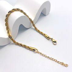 Crafted with meticulous attention to detail, this bracelet features a mesmerizing twisted chain design, adding a touch of glamour to any outfit. Whether you're dressing up for a special occasion or adding a chic accent to your everyday look, our bracelet is the perfect choice. Available in silver and gold Elegant Braided Bracelet With Adjustable Chain, Elegant Bracelets With Rope Chain And Link Shape, Elegant Bracelets With Rope Chain Link, Elegant Bracelets With Link Rope Chain, Elegant Rope Chain Link Bracelets, Elegant Rope Chain Link Bracelet, Elegant Formal Rope Chain Bracelet, Twisted Chain, Mini Twists