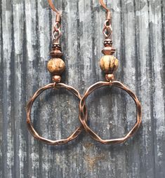 Hammered copper hoop earrings with picture jasper gemstones. These hammered copper hoop earrings are very lightweight and lovely! You will hardly know that you're wearing them except for all the compliments you'll be getting! The copper hoops have a hammered texture and an antique finish. The small round gemstones are picture jasper. The French ear wires are solid copper, not plated! These earrings are 2 inches long and 1 inch wide. As I mentioned, they are very lightweight! Only 2 grams. All my Petite Earrings, Dangle Earrings Boho, Nature Earrings, Insect Jewelry, Hippie Earrings, Jasper Earrings, Dragonfly Earrings, Dragonfly Pendant, Sterling Silver Wire Wrap