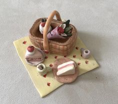 there is a small basket with soaps and other items on the table next to it