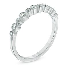 a white gold wedding ring with five stones on the side and four rows of diamonds at the top