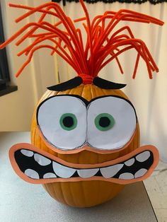 a pumpkin decorated like a cartoon character