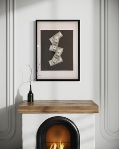 a fire place with a framed money bill on it