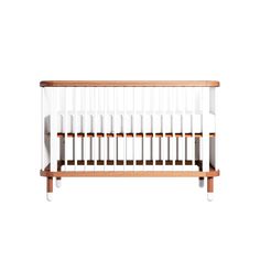 a white crib with wooden slats on the bottom and sides, against a white background