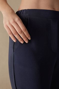 Full-length trousers featuring two pockets, faux back pocket and covered elasticated waist. Elastane Bottoms With Pockets Straight Hem, Elegant Bottoms With Patch Pockets For Business Casual, Elegant Trousers With Patch Pockets, Elegant Stretch Bottoms With Pockets, Elegant Workwear Bottoms With Patch Pockets, Elegant Stretch Bottoms With Side Pockets, Chic Blue Bottoms With Straight Hem, Elegant Stretch Pants With Side Pockets, Elegant Pants With Pockets And Straight Hem