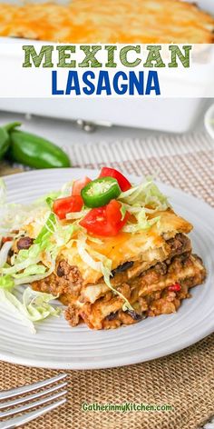 mexican lasagna with lettuce and tomatoes on top