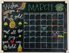 a chalkboard calendar with the words march written on it and shamrocks drawn on it