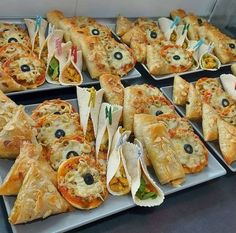 several trays filled with different types of food