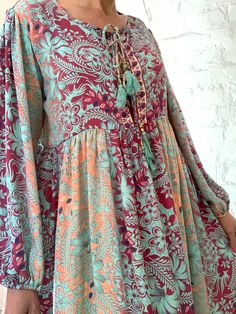 "This is beautiful light silky tunic dress with floral print in delicate blue and pink colours true boho chic style it is made loose and flared with high waist and long puff sleeve effortles to wear and easy fitting to all shapes perfect outfit for many occasions parties dinners birthday Christmas 😊 MEAESURE size M/L shoulders 18\" bust up to 40\" ( it is front tie srap, so can be easyli loosen up or tighten ) high waist 38\" length 45 \" MATERIAL *polisilk Thank You for looking" Billowy Long Sleeve Floral Maxi Dress, Spring Flowy Maxi Dress With Bishop Sleeves, Long Viscose Dress For Fall, Billowy Long Sleeve Floral Print Dress, Modest Billowy Maxi Dress, Non-stretch Floral Print Maxi Dress, Floral Print Dress With Bishop Sleeves For Fall, Flowy Long Sleeve Maxi Dress In Viscose, Fall Floral Print Dress With Bishop Sleeves