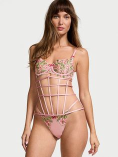 Show off your snatched waist and sexy curves with this underbust-style corset. Its edgy caged design is balanced beautifully with rosy-pink satin all around and is just right as a statement piece over dresses and button downs (or wear as part of a memorable lingerie look). Back hook-and-eye closures Hand wash Imported Pink Fitted Underwire Corset, Pink Underbust Feminine Corset, Pink Feminine Underbust Corset, Feminine Pink Underbust Corset, Pink Feminine Corset With Boned Bodice, Pink Strapless Corset With Boned Bodice, Strapless Pink Corset With Boned Bodice, Pink Underbust Corset For Summer, Summer Underbust Pink Corset