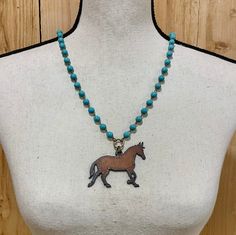 "Beautiful naturally aged prancing steel horse necklace. Large walking horse on turquoise necklace will perfectly complete your look. The contrast of the prancing horse pendant and the turquoise beads really make this necklace stand out.  Distinctive and durable cowgirl pendant necklace is a \"go-to\" accessory for horse lovers that will last years. Gives you a distinct style that gets comments like \"I love your necklace!\" or \"That is such a cool necklace!\" Makes a fantastic horse lover gift for her. She will be so impressed with your taste in jewelry. Makes great sister gift, best friend gift, mom gift, or any special occasion for her. *Quick Shipping. *100% handmade in the USA. *Highest quality materials - large turquoise necklace bead chain and thick heavy-duty connectors will last Western Equestrian, Prancing Horse, Walking Horse, Horse Pendant, Like I Love You, Country Vintage, Horse Necklace, Necklace Stand, Gift Photo