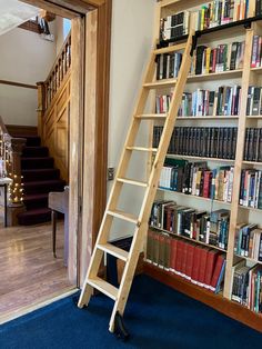 a ladder leaning up against a bookshelf filled with books