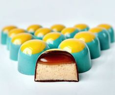 there are many small blue and yellow desserts