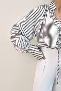 1.Product Details Size runs small，recommend one size up This blouse is ideal for wearing from desk to dinner. It’s shaped for a loose and lightweight fit with vertical stripes throughout(in olive color), a split high neck with self tie detail, and long cuffed sleeves. Style it with tailored pants for social occasions or pare it back with jeans for a dinner date. Fit Type: Regular Fit How it Fits: No Stretch Fabric: 96% Polyester, 4% Spandex Care Instructions: 1.Machine Wash at or below 30°C 2.Do not bleach 3.Line dry in shade 4.Iron cool (max 110â„? 5.Dry clean, tetrachloroethylene(PCE) only Please note: The images represent actual product though color of the image and product may slightly differ. 2.How To Measure It Model is wearing: M SKU: 2203AA0646GHXSSKU: ${data.sku} Wedding Tops, Retro Blouse, Lawyer Fashion, Lantern Sleeved Blouses, Jacquard Shirt, Fitted Turtleneck, Dinner Date, Lovely Clothes, Olive Color