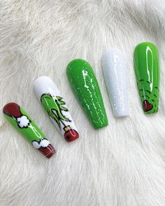 A gel polish, press-on nails set complete with green color, white and green glitter accents, and holiday movie detailing. Nail glue included in every purchase. Grinch Nails, Christmas Nail Art Easy, Christmas Manicure, Holiday Nail Designs, Cute Christmas Nails, Cute Acrylic Nail Designs, Christmas Nail Art Designs, Holiday Nail Art, Festival Nails