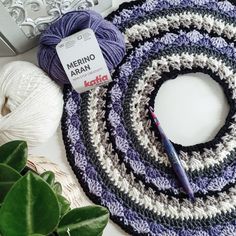 yarn and crochet items laid out next to each other on top of a table