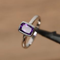 It is real natural amethyst ring, the cushion cut amethyst is about 6mm*8mm. The basic metal is sterling silver and plated with rhodium. To change the metal to a solid gold (white/rose) or platinum is also available, please ask for a quotation if you want. You can also go to my shop Home Cushion Cut Amethyst Jewelry Gift, Fine Jewelry With Cushion Cut Amethyst, Fine Jewelry Cushion Cut Amethyst, Cushion Cut Amethyst Fine Jewelry, Classic Cushion Cut Amethyst Jewelry, Purple Cushion Cut Jewelry Gift, Purple Cushion Cut Fine Jewelry, Classic Cushion Cut Purple Jewelry, Classic Purple Cushion Cut Jewelry