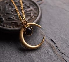 A bewitching necklace: the delicate onyx drop is a perfect match for the matte finished, 24k gold plated brass moon. This piece looks gorgeous worn on its own or is fantastic layered with other necklaces. ⟴ Onyx is the ancient birthstone for July and is associated with the zodiac sign of LeoTurquoise: https://www.etsy.com/ca/listing/735203333/moon-necklace-celestial-jewelryAmethyst: https://www.etsy.com/ca/listing/741246762/amethyst-necklace-boho-necklaceMoonstone: https://www.etsy.com/ca/listin Physical Manifestation, Witch Moon, Half Moon Necklace, Moon Necklace Silver, Black Onyx Necklace, Magic Aesthetic, Crescent Moon Pendant, Witch Jewelry, Celestial Necklace