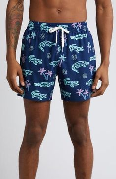 Lightweight and perfectly stretchy, these lined swim trunks move easily in the water and dry quickly on land for comfort no matter where you take them. 5 1/2" inseam; 22" leg opening; 11" front rise; 14 1/2" back rise (size Medium) Lined 92% polyester, 8% spandex Machine wash, tumble dry Imported Casual Relaxed Fit Swim Trunks For Pool, Hawaiian Style Short Swimwear For Swimming, Casual Swim Trunks For Swimming, Casual Swim Trunks For Warm Weather Swimming, Casual Swim Trunks For Warm Weather, Casual Swim Trunks For Pool In Warm Weather, Navy Go-dry Bottoms For Summer, Casual Nylon Swim Trunks For Poolside, Casual Short Swim Trunks For Swimming