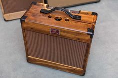 two old fashioned wooden amps sitting next to each other