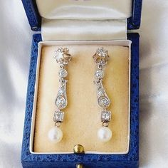 Beautiful diamond earrings, rare and full of nobility, set in platinum. From the Belle Époque period, translated as "the beautiful era," these earrings are a unique item for collectors and connoisseurs, featuring real diamonds and natural pearls in platinum. The earrings have a stud design with the appearance of dangling earrings, offering an elegant length that adds beauty and softness to the look. Set with diamonds and gold engravings, the mesmerizing lace decorations culminate in a round pearl at the end, perfectly finishing the elegant design. Crafted from platinum with rare diamonds, these earrings weigh 5.1 grams and measure 4 cm in length. They capture the essence of antique Belle Époque era jewelry, blending vintage style from the 1920s with the timeless elegance of old diamond ear Exquisite Hallmarked Bridal Earrings For Formal Occasions, Victorian Style Formal Pearl Drop Earrings, Exquisite Hallmarked Diamond Earrings For Formal Occasions, Vintage White Diamond Earrings For Formal Occasions, Hallmarked Platinum Diamond Earrings For Wedding, Wedding Platinum Hallmarked Diamond Earrings, Wedding Platinum Diamond Earrings Hallmarked, Antique Drop Pearl Earrings For Formal Occasions, Antique Pearl Drop Earrings For Formal Occasions