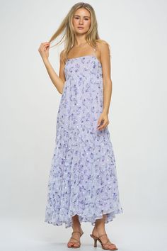 A gorgeous ditsy floral pattern flows throughout this whimsical asymmetric tiered maxi dress. Embroidery detail and unique seaming give a luxe, feminine feel to this warm-weather style. Pair with slide sandals or block heels to elevate the look. Product Details Material: 100% Polyester. Fit: True to size. Body length: 52" from shoulder to hem (size Small). Fabric: Lightweight chiffon.Features: Adjustable spaghetti straps, asymmetric tiers, raised hemlines, embroidered white flowers, fully lined. Feminine Spring Chiffon Maxi Dress, Tiered Floral Print Maxi Dress For Summer, Spring Breezy Tiered Maxi Dress, Summer Tiered Maxi Dress With Floral Print, Summer Ditsy Floral Print Tiered Dress, Summer Ditsy Floral Print Tiered Skirt Dress, Spring Garden Party Tiered Maxi Dress, Tiered Maxi Dress For Spring Garden Party, Summer Dress With Ditsy Floral Print And Tiered Skirt