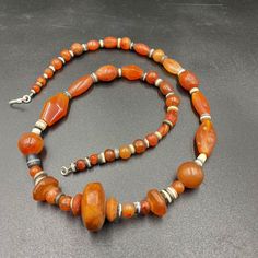 Beautiful Ancient Indo-Tibetan Carnelian And Banded Agate Beads Necklace. The Age Of This Beads More Than 1000 Years From Ancient Himalayan Cultures Civilizations. The Carnelian Beads Got Very Beautiful Color And Very Smooth Skin Its Because Of Long Passage Of Time Using. Conditions Of Beads As Shown In The Pictures. Quite Long String Necklace Many Beads In The Strings. Bohemian Orange Carnelian Beads, Bohemian Carnelian Beads For Jewelry Making, Bohemian Carnelian Round Bead Necklace, Bohemian Carnelian Gemstone Beads, Bohemian Carnelian Beads And Cabochons, Bohemian Amber Agate Beads, Bohemian Polished Carnelian Beads, Traditional Orange Beaded Necklaces With Gemstone, Bohemian Carnelian Beads With Natural Stones