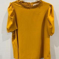 Plus Size Color: Mustard 97% Polyester 3% Spandex Keyhole Back Button Closure Solid Color Stretch Blouse For Day Out, Stretch Solid Color Blouse For Day Out, Stretch Puff Sleeve Work Top, Stretch Short Sleeve Puff Top For Work, Stretch Puff Sleeve Top For Work, Stretch Puff Sleeve Blouse For Brunch, Casual Puff Sleeve Top With Stretch For Work, Casual Stretch Puff Sleeve Top For Work, Stretch Puff Sleeve Tops