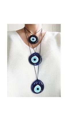 Evil eye necklaces are adjustable with 2 cord color options( dark blue and black) You can easily adjust the lenght of the nazar necklace. Blue evil eye pendant is 2 in (5 cm) Extra Large Evil Eye pendant is made of glass. This Turkish Eye Jewelry is great for daily wear. It would also be the perfect amulet gift. Please choose the longest lenght and the cord color of the necklace you prefer during check-out. For more evil eye necklaces, click the link below; https://www.etsy.com/shop/EyeDesignsby Nazar Necklace, Evil Eye Choker, Round Evil Eye, Necklace Evil Eye, Turkish Eye, Protection Amulet, Evil Eye Earrings, Protection Necklace, Blue Evil Eye