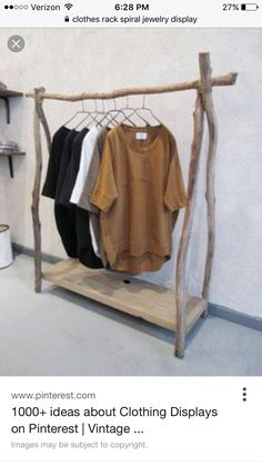 an image of clothes hanging on a rack in the store that is instagramted