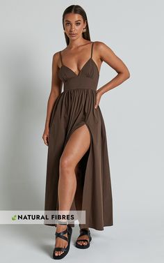 Get ready to turn heads in the Haydie Maxi Dress. This stunning chocolate brown dress is perfect for any occasion, from casual weekend activities to special events. With its flattering fit and flare silhouette and thigh-high split, this dress will make you feel confident and empowered wherever you go. The plunging V-neck adds a touch of allure, while the sleeveless design keeps you cool on those warm summer days. Made with soft cotton fabric, this maxi dress is not only stylish but also comforta Brown Maxi Dress For Date Night, Brown Maxi Dress With Side Slits, Fitted Brown Dresses With Side Slits, Fitted Brown Dress With Side Slits, Fitted Brown Maxi Dress For Date Night, Brown Maxi Length Dress For Night Out, Brown Maxi Dress For Night Out, Casual Brown Maxi Dress For Night Out, Thigh Split Dress