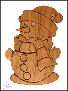 a wooden cutout of a snowman