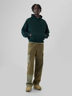 Soft, stretch cotton twill cargo pants.  Elasticized waist with drawcords.  Front slant pockets, back welt pockets.  Side cargo pockets.  Ties at hem for cinching.  Allover patchwork detailing.  This pant is made with 98% regenerative cotton, which is grown using holistic agricultural practices that improve soil health, climate resilience, water retention, and local biodiversity.  This product was made in a factory that invests in gender equality and women’s empowerment.  Through RISE Reimaginin Relaxed Fit Green Cargo Jeans With Hip Pockets, Sporty Gap Sweatpants For Streetwear, Green Cotton Cargo Jeans With Patch Pockets, Green Cotton Cargo Pants With Multiple Pockets, Khaki Utility Cargo Sweatpants, Khaki Utility Cargo Style Sweatpants, Baggy Green Cargo Jeans With Patch Pockets, Green Baggy Cargo Jeans With Patch Pockets, Sporty Gap Bottoms With Side Pockets