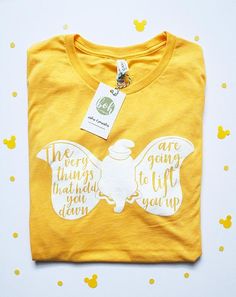 a yellow tshirt with an image of a butterfly that says, they are going to birthdays you up there