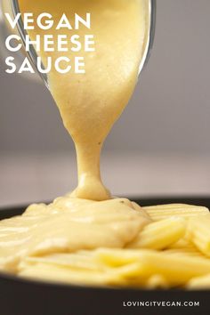 the sauce is being poured over pasta in a skillet