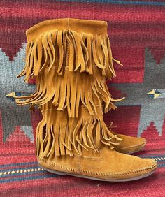 "BlackbirdSedona presents to you these Ladies Minnetonka vintage moccasin boots. They are a brown soft suede. They are 12\" High and are accented with 3 layers of fringe. These comfy shoes have rubber soles. They are in distressed and broken-in vintage condition, with signs of wear such as scuffing, soiling, and wear to soles and heels. Marked a ladies size 8. Condition notes: -Soiling inner shafts -Heavy curling of the Fringe -Heavy wear to soles Please ask questions through Etsy messages. Sinc Moccasins Boots, Pendleton Wool Blanket, Fringe Moccasin Boots, Fringe Moccasins, Stacked Heel Boots, Black Cowboy, Native Shoes, Reversible Scarf, Sedona Az