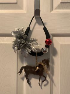 a horse ornament hanging on the front door