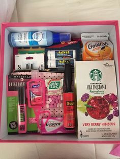 a pink box filled with lots of different items